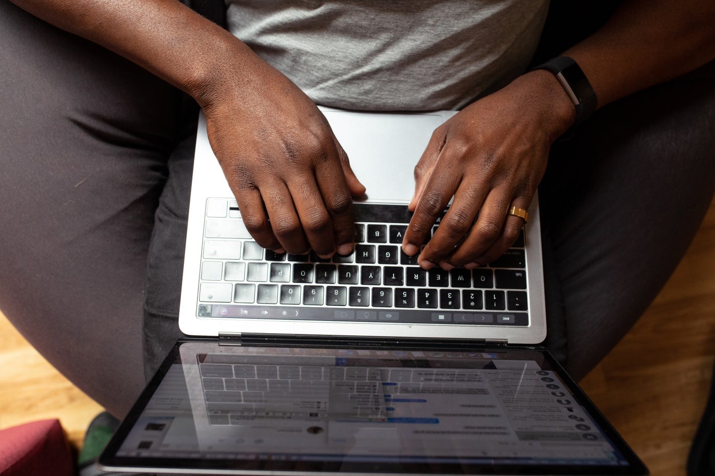 A developer typing on a laptop